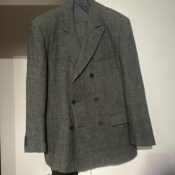 This is a 2 piece men suit. The suit is a grey 100% wool suit. - Picture 1 of 2